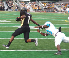 Justin King flies past a Woodland Hills defender