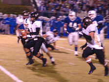 QB Aaron Smith rounds the corner running the option.